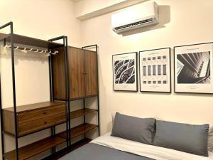 a bedroom with a bunk bed and a air conditioner at Urban Seaview with Infinity Pool, Luxury Modern Stylish 7pax 3Bedroom 3Queen in Jelutong +52 photos