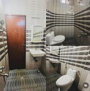 a bathroom with two toilets and a sink at Cape-Cottage in Nāgercoil