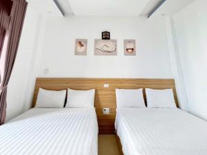 Postel nebo postele na pokoji v ubytování Thanh Hiền HB Hotel
