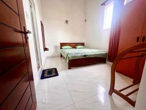 Postel nebo postele na pokoji v ubytování Ameesha Guest House + 8 fotografií