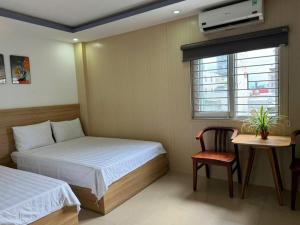 Postel nebo postele na pokoji v ubytování Thanh Hiền HB Hotel