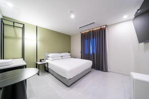Seosan Hotel Posto客房内的一张或多张床位