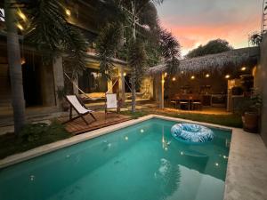 a swimming pool in the backyard of a house at Casa Monika in Puerto Escondido