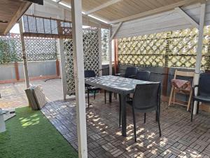 a table and chairs on an outdoor patio at Casa Sandra in Pirri