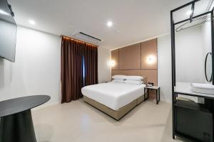Seosan Hotel Posto客房内的一张或多张床位