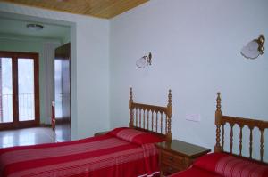 Postel nebo postele na pokoji v ubytování Hostal Fondevila