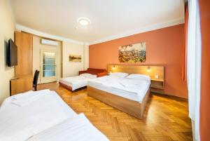 Postel nebo postele na pokoji v ubytování Residence BENE