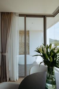 Postel nebo postele na pokoji v ubytování Elite Atoll Serviced Apartments Phuket