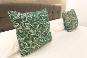 two pillows sitting on top of a bed at Harmonie House in Verona