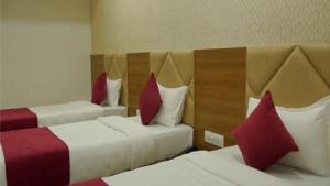 Hotel Rk Arcade客房内的一张或多张床位