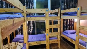 Postel nebo postele na pokoji v ubytování Hostel At Regalia Residence