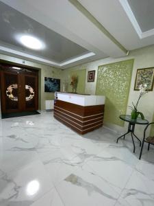 a lobby with a large marble floor and a table at Рутенія in Skhidnitsa +291 photos