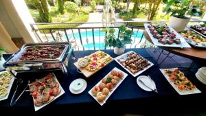 a blue table topped with lots of different types of food at Midrand Conference Centre in Midrand