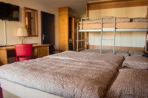 Ένα ή περισσότερα κρεβάτια σε δωμάτιο στο Alpine Classic Hotel