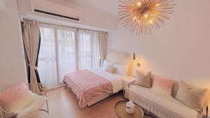 Postel nebo postele na pokoji v ubytování 所在行旅2館-渡咕所在 UrbanAbode2-DUGU