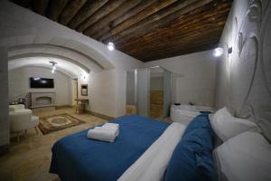 Postel nebo postele na pokoji v ubytování Mayda Cappadocia