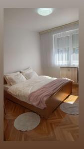 Ένα ή περισσότερα κρεβάτια σε δωμάτιο στο HANA Apartment