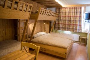 Ένα ή περισσότερα κρεβάτια σε δωμάτιο στο Alpine Classic Hotel