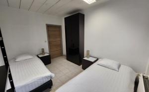 Ένα ή περισσότερα κρεβάτια σε δωμάτιο στο Mathilda - apartments