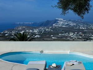 a swimming pool with a view of a city at Zannos Melathron in Pirgos