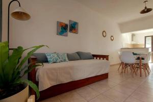 a bedroom with a bed and a table and chairs at Los Aromos Sinsacate in Sinsacate