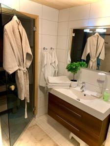 a bathroom with a sink and a mirror at Holiday Home Birdie in Naantali +50 photos