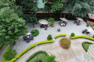 an overhead view of a garden with tables and umbrellas at Buki Boutique Hotel Lazimpat in Kathmandu