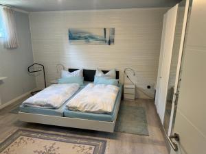 Postel nebo postele na pokoji v ubytování Ferienwohnung Höhenweg 25