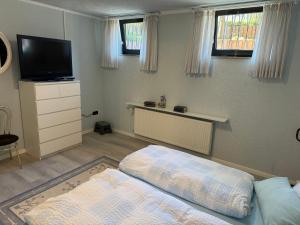 Postel nebo postele na pokoji v ubytování Ferienwohnung Höhenweg 25