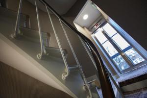 a set of stairs in a train with a window at Le Mireille in Paris