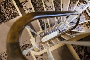 a view of a spiral staircase with a chair at Le Mireille in Paris