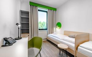 Tempat tidur dalam kamar di Hotel Active Stadium