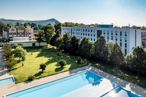 an overhead view of a garden with a swimming pool at Hotel Active Stadium in Lovosice