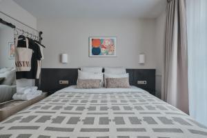 a bedroom with a large bed in a room at Nestay Sentier in Paris