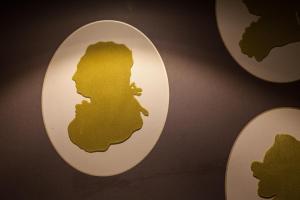 a close up of the apple logo on a wall at Le Mireille in Paris