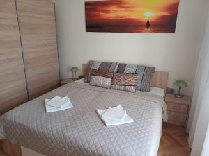 Posteľ alebo postele v izbe v ubytovaní Joe Beach Apartman