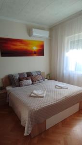 Posteľ alebo postele v izbe v ubytovaní Joe Beach Apartman