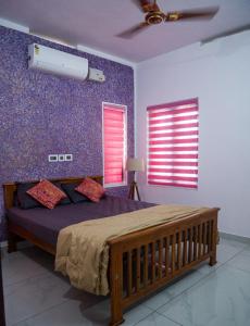 Postel nebo postele na pokoji v ubytování Varkala Life Homestay