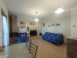 a living room with a couch and a table at House 39 in Capranica
