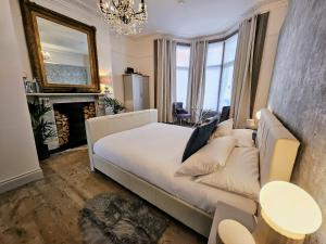 a living room with a couch and a fireplace at INNit Marina in Brighton & Hove