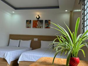 Postel nebo postele na pokoji v ubytování Thanh Hiền HB Hotel