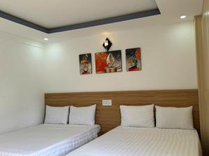 Postel nebo postele na pokoji v ubytování Thanh Hiền HB Hotel