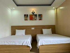 Postel nebo postele na pokoji v ubytování Thanh Hiền HB Hotel