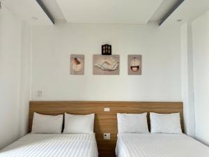 Postel nebo postele na pokoji v ubytování Thanh Hiền HB Hotel