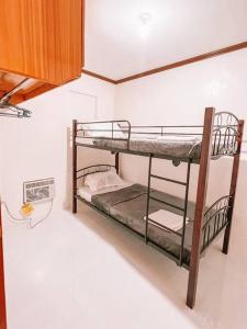 Postel nebo postele na pokoji v ubytování Dream Haven Homestay Deca Clark