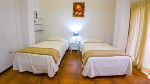 Postel nebo postele na pokoji v ubytování La Casa de Marita