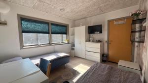 A bed or beds in a room at Pavillon Greve