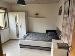 A bed or beds in a room at Pavillon Greve
