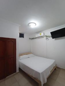 Postel nebo postele na pokoji v ubytování Hostal Miami Beach