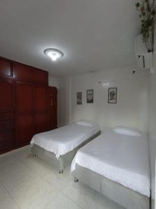 Postel nebo postele na pokoji v ubytování Hostal Miami Beach